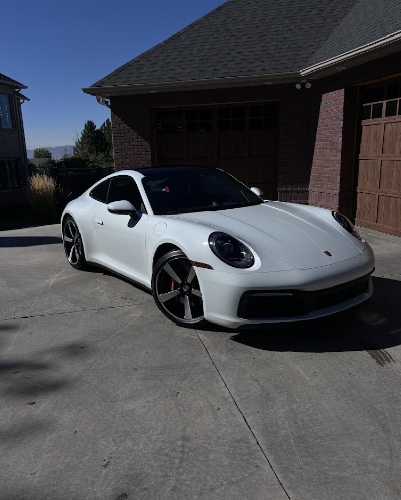 White Porsche 911 gleaming after a premium exterior detail in Alpine, UT